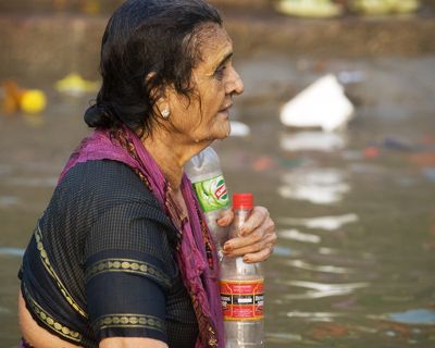 Woman Drinking the Ganges Water